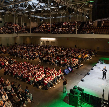 Sam Rapoport, Keynote speaker addressing large audience at conference event