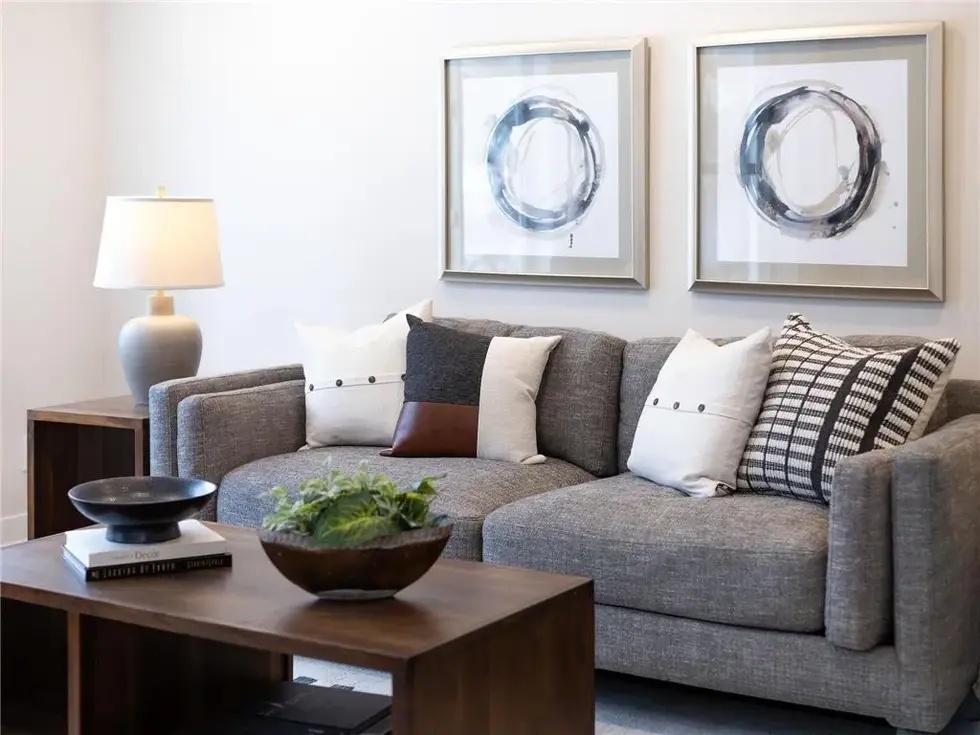 Styled gray couch and coffee table area in the living room