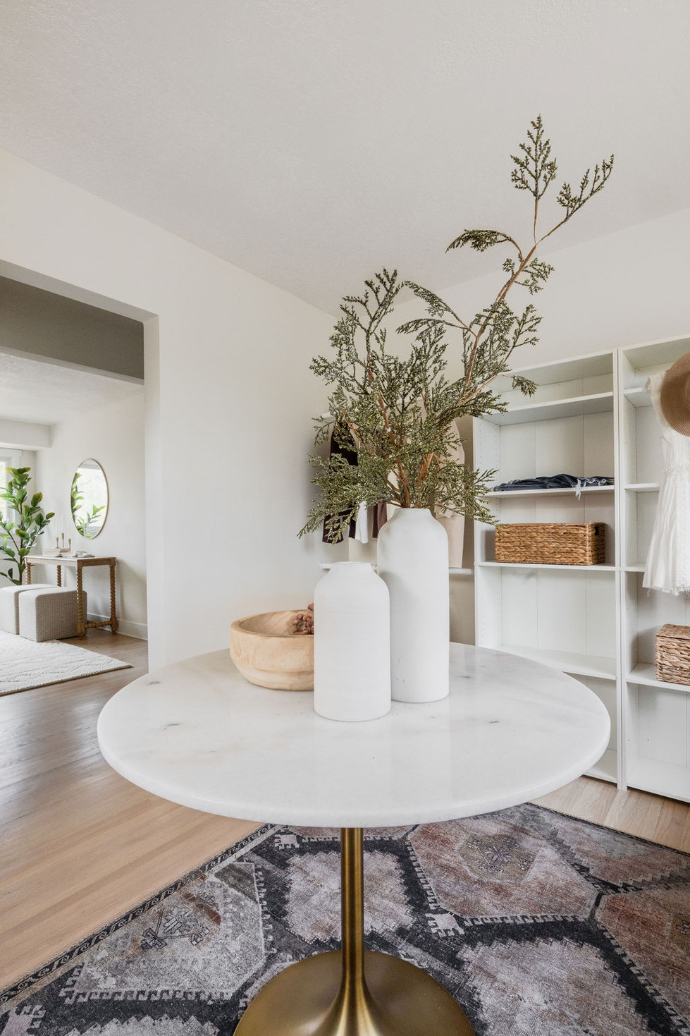 Modern entryway with plants on a marble table