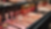 High angle view of a makeup display with various colorful cosmetic products arranged neatly