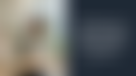 Professionally dressed Asian woman sitting at a desk writing in a notebook. Text overlay "Six things to do in your first 90 days as a senior HR leader.)