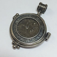 The reverse of the hand made Bezel and Roman Republic coin