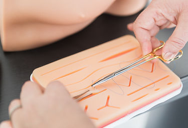 needle moving through fake skin