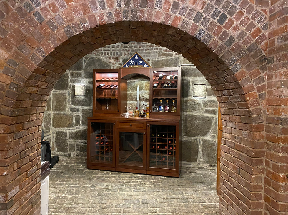 wine cellar, storage, basement, brick, stone, wall sconces, wood