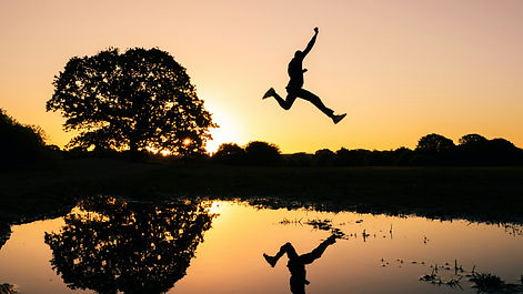 man jumping over water.jpg