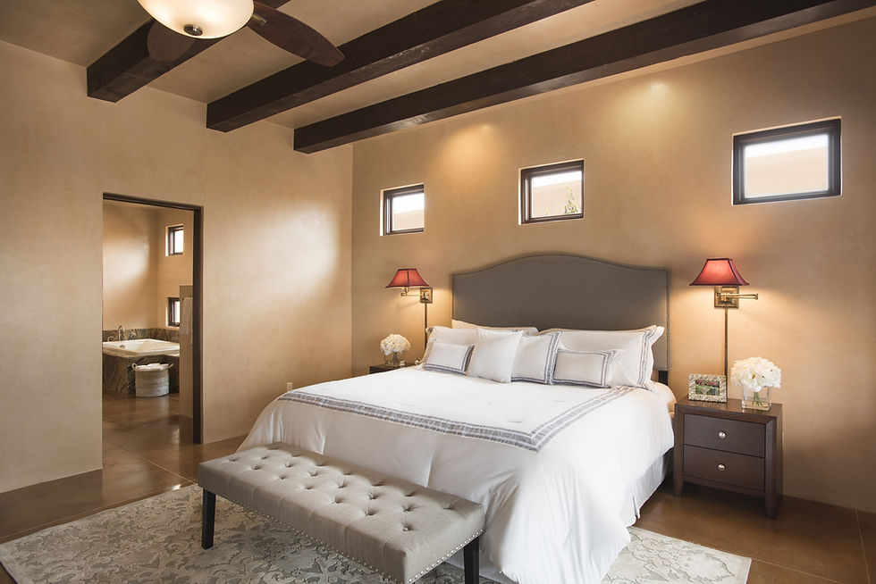 Updated decor in pueblo-style master bedroom suite gives potential buyers appreciation of space.