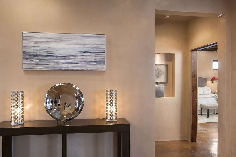 Modern decor in silvers and greys compliments warm diamond plaster walls in contemporary Santa Fe home.