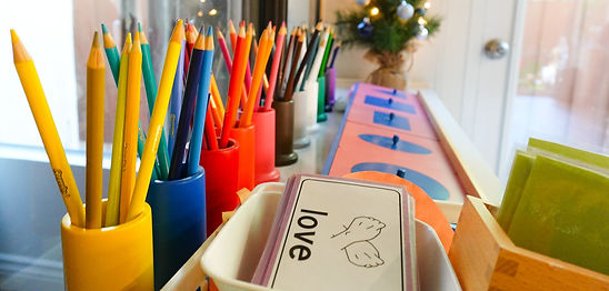 Montessori daycare contact materials with pencils and love card