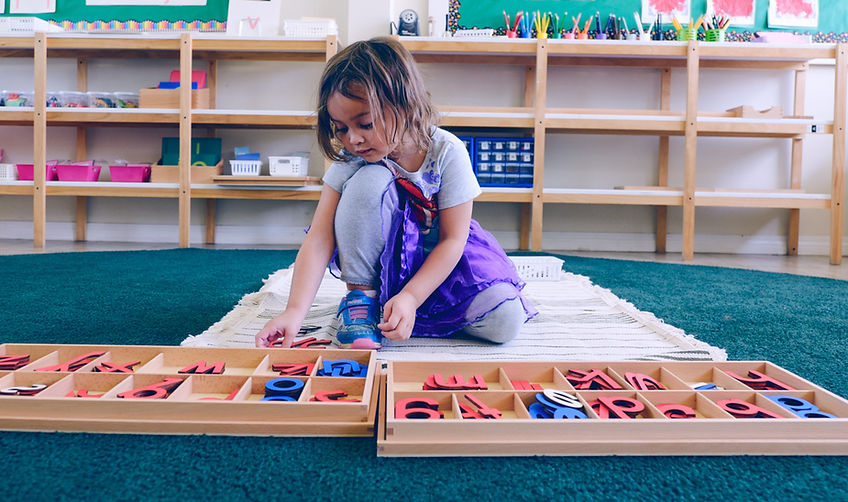 Montessori child sorting learning materials