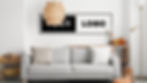 Cozy living room with a gray sofa, neutral cushions, wicker lamp, and pumpkins. A framed sign reads "YOUR LOGO." Modern and inviting.