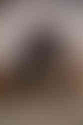 Bride and groom pose for wedding photo under celestial arch