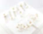 Luxury bridal hair pins featuring ceramic blooms, freshwater pearls, and hematite accents.