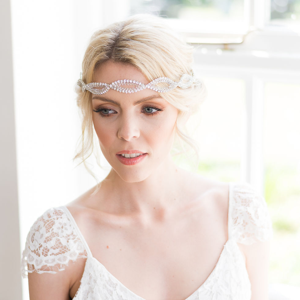 Thumbnail: Woman in white dress wearing elegant silver headband