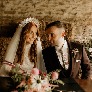 bride and groom at the head of the table, a rustic barn wedding