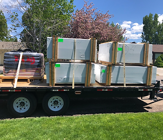Mr. Fence trailer loaded with concrete and fence materials for DIY fencing in Ammon, Idaho