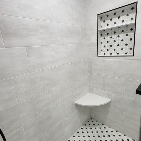 Custom walk-in shower in North Bellmore NY with built-in bench and niche