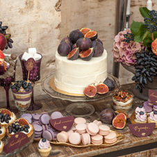 Elegant dessert table with figs and macarons