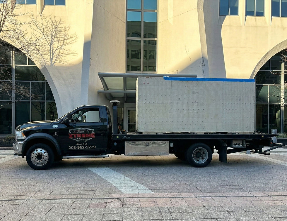 Specialized heavy-duty hauling of commercial delivery vans and machinery by Xtreme Towing.
