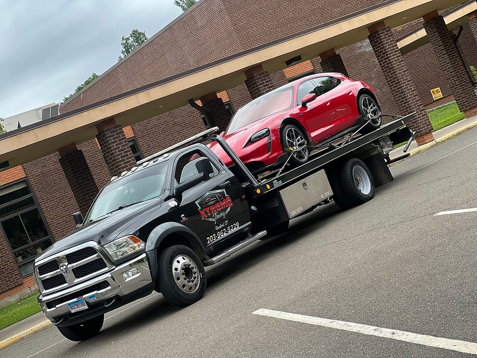 Xtreme Towing emergency roadside recovery vehicle assisting a driver on I-95