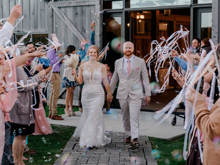 bride and groom exit Chattanooga wedding venue with bubbles and streamers