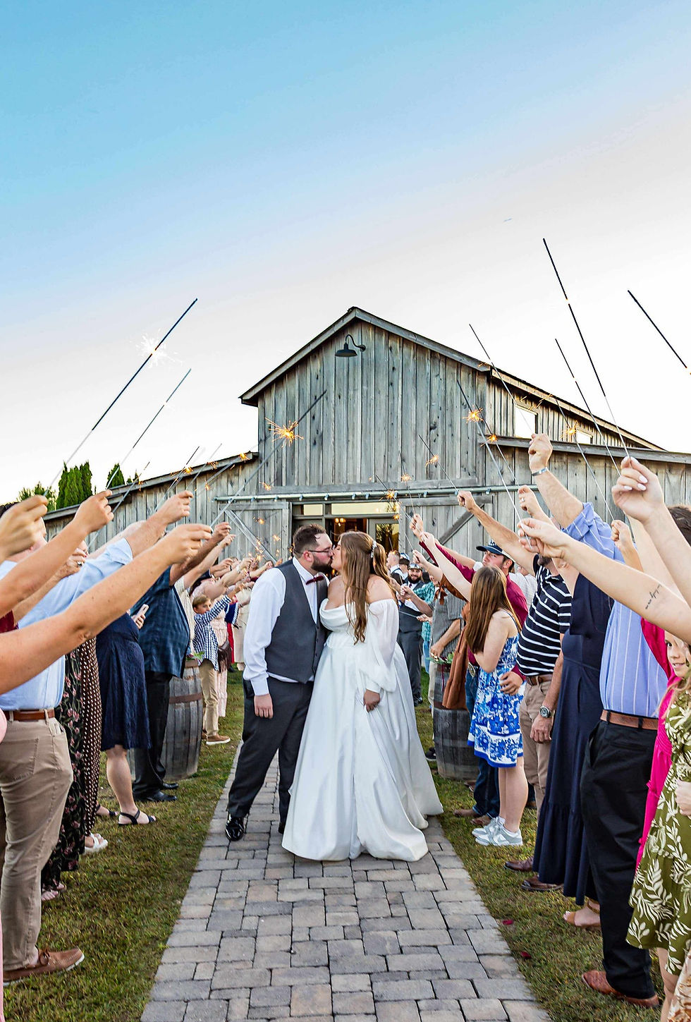Eye-level view of a rustic wedding venue with wooden beams and soft lighting