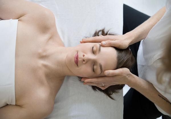 Woman receiving facial massage