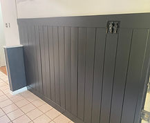 Painted wood wall paneling and walls.