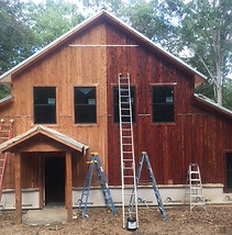 Stained outdoor new construction home and cabin.