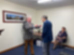 Lloyd receiving his OAM from Governor of Queensland Paul de Jersey AC in September 2020.