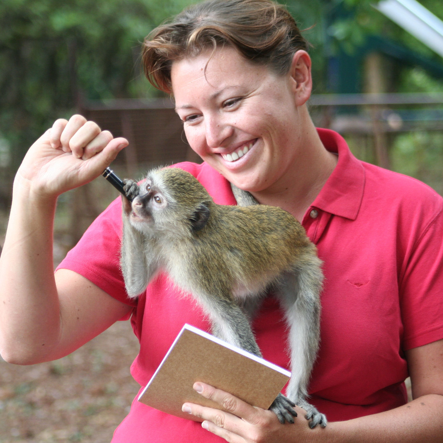 Renee Jean with a cheeky vervet monkey in Africa