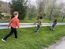 3 foster children walking outside