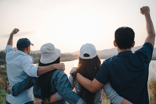 vecteezy_group-of-people-with-raised-arms-looking-at-sunrise-on-the_6185642-2048x1365.jpg