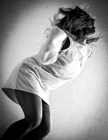 A woman dances carefree at teh Hammer Museum, LA