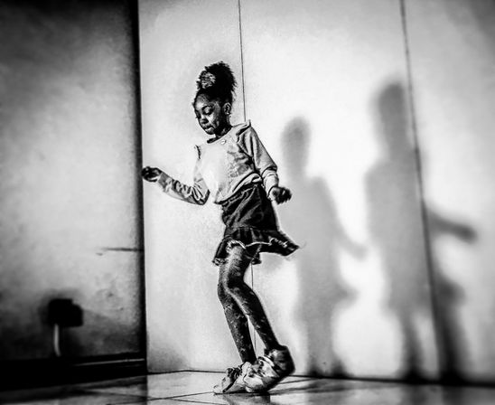 An african+american girl dances