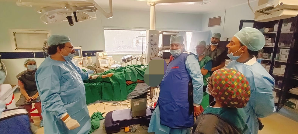 Doctors in scrubs and masks gather around a patient on an operating table in a well-equipped surgical room. Mood is focused and professional.