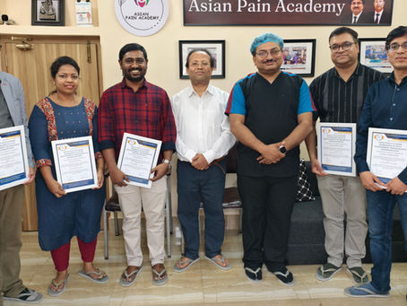 Group photograph at Asian Pain Academy showing doctors and participants standing together after a pain management workshop