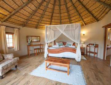 Hippo Suite 2 garden chalet interior view of the bedroom at Horizon's Lodge in South Africa.