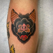 Color American Traditional bat head leg tattoo done by Bobby McGee at Cosmic Primate Tattoo in Hatboro, Pa