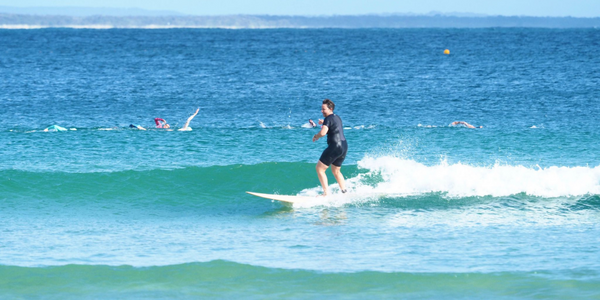 Woman surfing a small wave