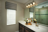 faux wood blinds with a cornice in a bathroom VU Window Treatments