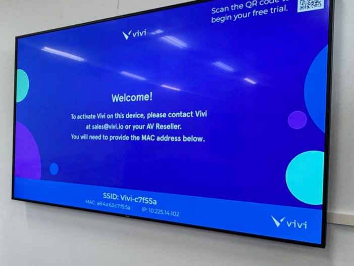 Large display screen showing a Vivi welcome screen with setup instructions