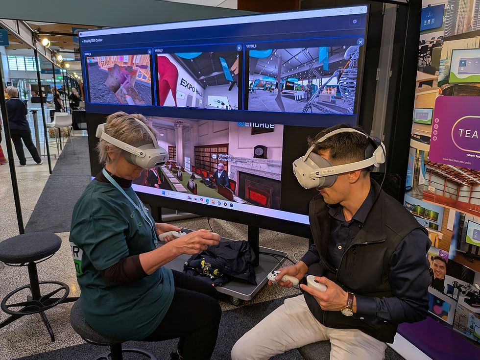 Two people using VR headsets with RealityTEK in a classroom.