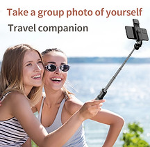 Two people taking a photo together with a phone on a selfie stick