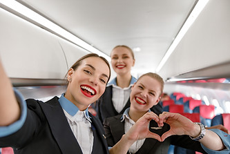 FlyingMedicine - happy young cabin crew.jpg