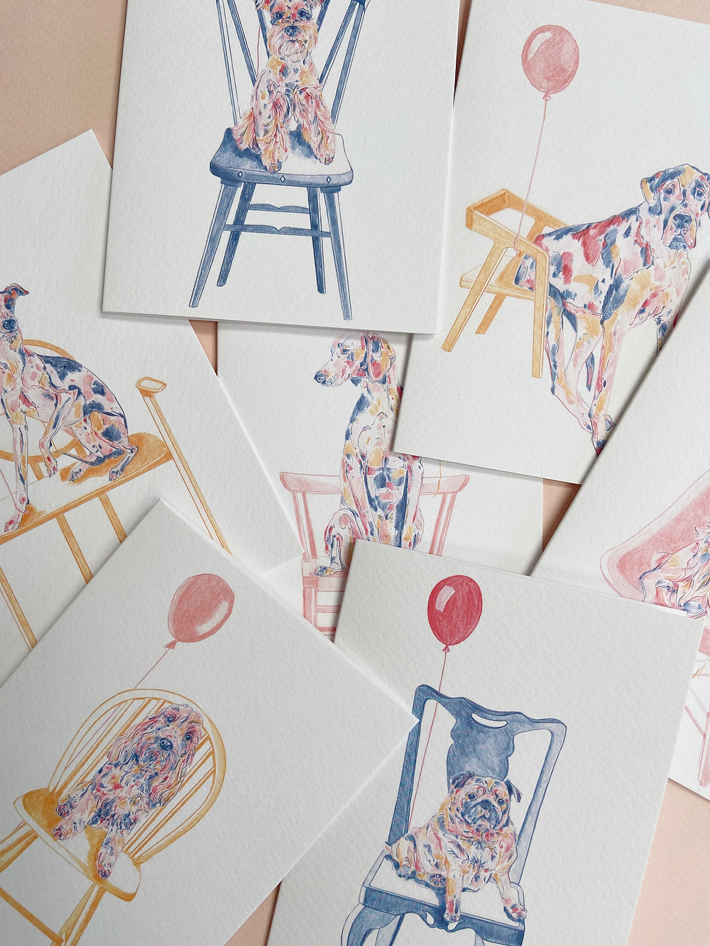Colourful drawings of dogs on chairs with balloons. Birthday cards.