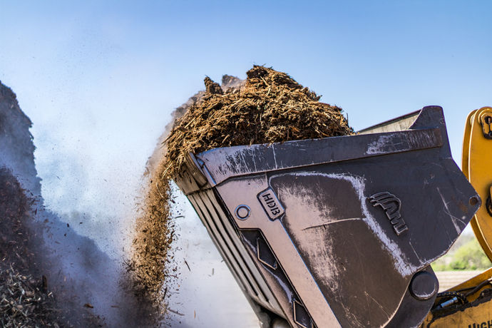 Mulch spilling out of bucket