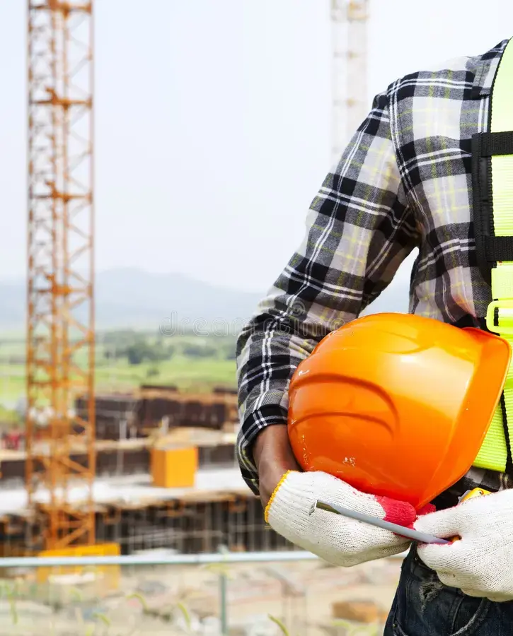 vertical-image-construction-safety-concept-close-up-worker-holding-helmet-33226974.webp