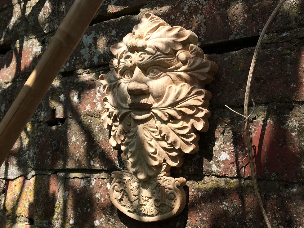 Symbolic representation of the Green Man surrounded by leaves, embodying the concept of rebirth and growth.