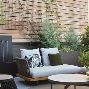 fountains next to an outdoor sofa and lounge area