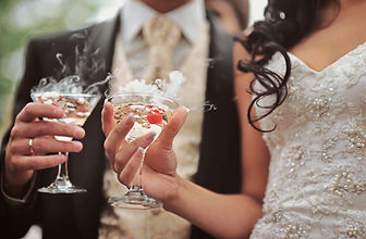 groom-and-bride-holding-cocktail-drinks.jpg